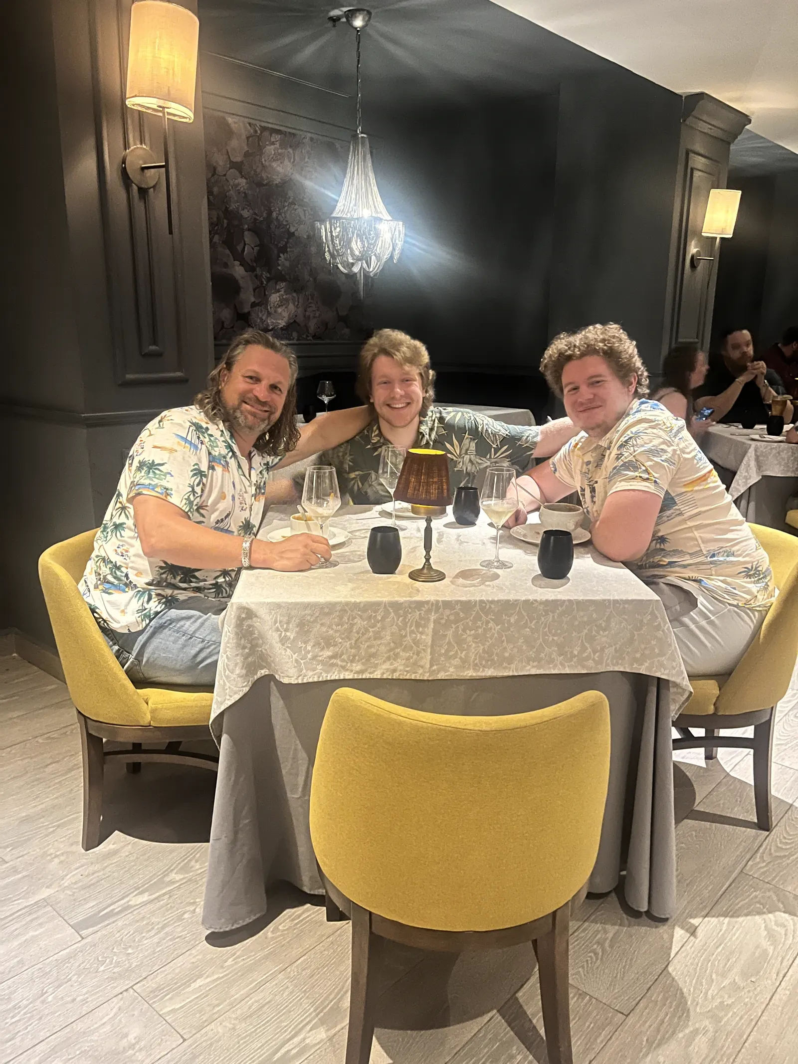 Three adult players sharing dinner at the resort restaurant in Cancún